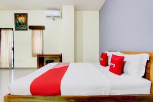 Voodi või voodid majutusasutuse Hotel O Pogung Near Near Ugm Formerly Maleo Residence toas