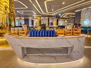 a lobby with a counter with blue barrels on it at View 2Bdr Lux Life Rawai in Rawai Beach