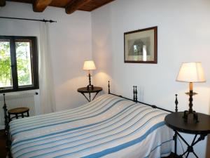 Een bed of bedden in een kamer bij Agriturismo Beria de Carvalho de Puppi