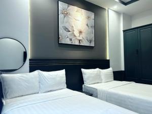 Postel nebo postele na pokoji v ubytování GALANG HOTEL