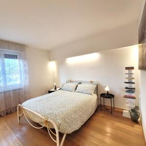 Postel nebo postele na pokoji v ubytování Casa Gianpi Mountain Lake Iseo Hospitality