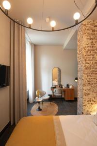 Postel nebo postele na pokoji v ubytování Boutique Hotel Kint