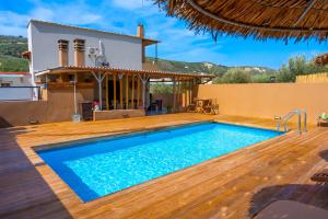 a villa with a swimming pool and a house at Countryhouse Villa with pool & private parking in Heraklio Town