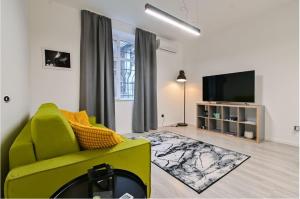 TV a/nebo společenská místnost v ubytování Apart Hotel Roma