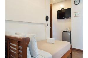 Postel nebo postele na pokoji v ubytování Townhouse OAK Metro Manila Near Osmena Highway PNR Pasay formerly Avitel Hotel