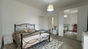 a bedroom with a bed and a walk in closet at Le Suites di Teodoro in Maiori