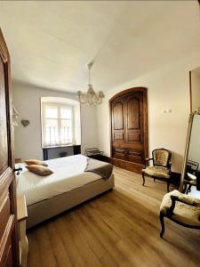 Postel nebo postele na pokoji v ubytování Schmoutzi & Schatzi - Au cœur de la ville