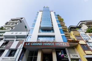 a tall building with a sign that reads le grand harriot hotel at Collection O Le Grand Hanoi hotel - The Sun in Hanoi