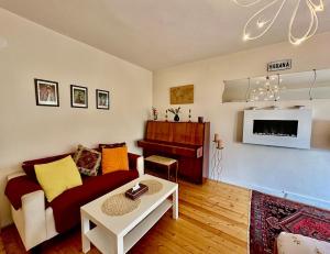 a living room with a couch and a table at Mary's Guesthouse in Banya