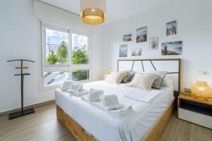 Ένα ή περισσότερα κρεβάτια σε δωμάτιο στο 3102 CAPRI Apartamento +40 φωτογραφίες