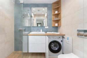 Ένα μπάνιο στο Apartment Relax with Parking Shellter Rogowo Renters Prestige