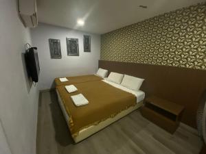 Postel nebo postele na pokoji v ubytování Hotel O Hotel Hamilas