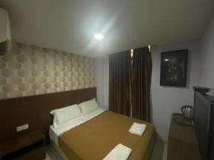 Postel nebo postele na pokoji v ubytování Hotel O Hotel Hamilas