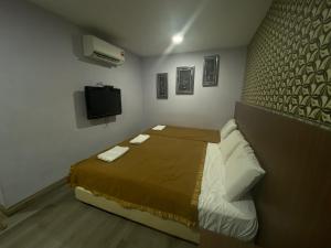 Postel nebo postele na pokoji v ubytování Hotel O Hotel Hamilas