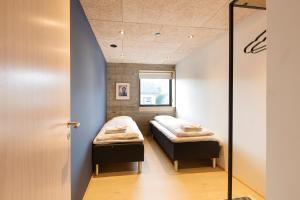 Postel nebo postele na pokoji v ubytování Á Varða Apartments