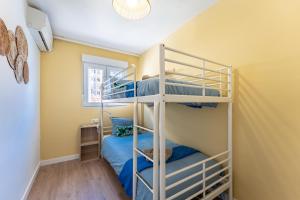 a bunk bed room with two bunk beds at Sunset House in Málaga