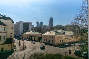 an aerial view of a city with buildings and a street at Wola Ratusz Serene Apartment by BookingHost in Warsaw