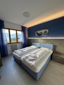 Postel nebo postele na pokoji v ubytování Andreis Apartments