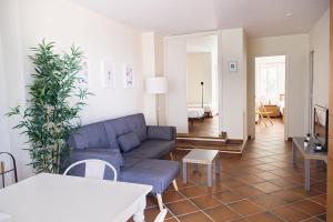 a living room with a couch and a table at Calafate 4 in L'Ametlla de Mar