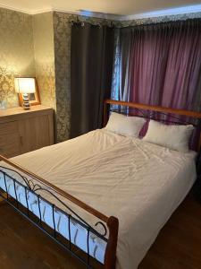 a bedroom with a large bed with a wooden headboard at Private pool 2 rooms in Biograd na Moru +18 photos