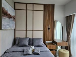 Postel nebo postele na pokoji v ubytování Inspiria Condo in Poblacion - Walk to Abreeza Mall