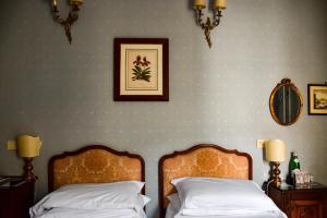Postel nebo postele na pokoji v ubytování Hotel Hermitage