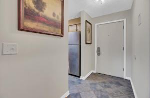 a hallway with a refrigerator in a house at Lagoon Villas 13 by Wild Dunes, with Amenities in Isle of Palms +49 photos