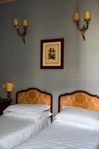 Postel nebo postele na pokoji v ubytování Hotel Hermitage