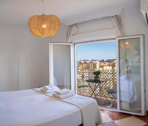 Posteľ alebo postele v izbe v ubytovaní Malaga Center Flat Hospitality