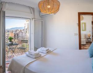 Posteľ alebo postele v izbe v ubytovaní Malaga Center Flat Hospitality