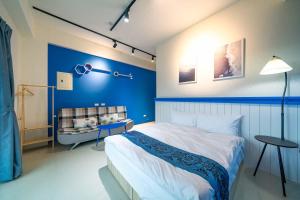 Postel nebo postele na pokoji v ubytování 寵物友善-無門禁24小時進出-曼曼玩民宿-免費停車