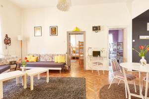 a living room with a couch and a table at Get Inn Skopje Hostel in Skopje