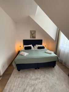 A bed or beds in a room at Penzión U Srnčíka Még 33 kép