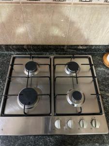 a stove top with four burners on top of it at La casa de Felipe y Paquita in Guadix