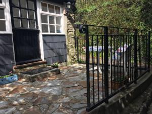 a wrought iron fence in front of a house at Tregenver Lodge in Falmouth