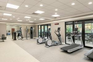 a gym with treadmills and elliptical machines at Courtyard by Marriott Boynton Beach in Boynton Beach