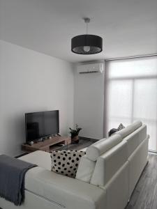 Televízia a/alebo spoločenská miestnosť v ubytovaní Nuevo Loft,cerca de la playa