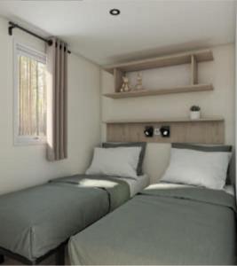 Postel nebo postele na pokoji v ubytování Camping maeva Escapades du Château de l'Hom