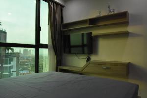 Postel nebo postele na pokoji v ubytování Dusit Grand Condo View + 10 fotografií