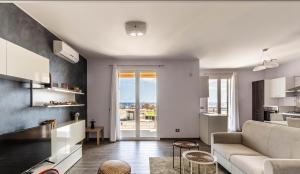 a living room with a couch and a table at Campisi Luxury Apartments in Avola