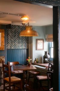 a dining room with a table and chairs at The Old Success Inn in Sennen Cove