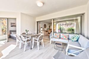 a living room with a couch and a table at Colinas - Timanfaya 03 VISTA RESERVA NATURAL Y JARDIN in Palm-mar