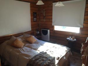 Llit o llits en una habitació de Cabanas Peumahue