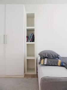 a bed with two pillows on it in a room at close to norreport st & central 302 - norregade 34a 3 kobenhavn 1165 in Århus Østbanegård