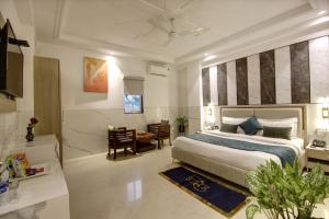 Postel nebo postele na pokoji v ubytování Hotel DELHI 37 by STAR GROUP