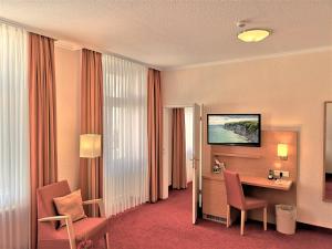 TV a/nebo společenská místnost v ubytování Hotel Villa Meeresgruss