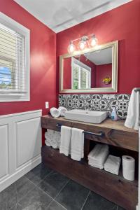 a bathroom with a sink and a mirror at Coastal Haven Awaits Discover Conception Bay South in Topsail +18 photos