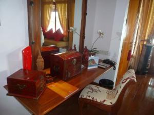 a desk with several boxes on top of it at Hidden Paradise Private Villa 3, Langkawi in Teluk Datai