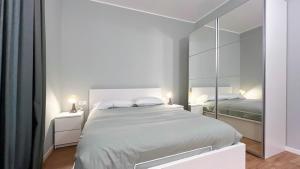 Postel nebo postele na pokoji v ubytování Appartamento Cavour - Affitti Brevi Italia