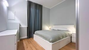 Postel nebo postele na pokoji v ubytování Appartamento Cavour - Affitti Brevi Italia